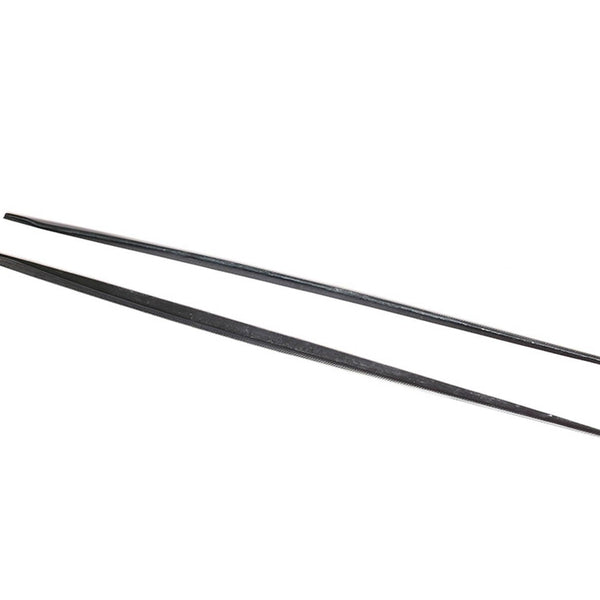 Two black chopsticks lie parallel, slightly spaced apart, on a white background. The chopsticks appear smooth and uniformly tapered towards the ends, set in a simple, minimal context.