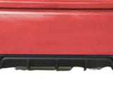 Red car rear with dual exhaust pipes emitting no smoke, set in a plain white background, highlighting the bumper and diffuser details.