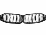 A black, double kidney-shaped car grille with vertical slats is displayed against a white background, showcasing its sleek, glossy design typically used in vehicle fronts.