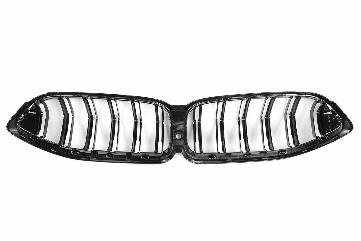 A black, double kidney-shaped car grille with vertical slats is displayed against a white background, showcasing its sleek, glossy design typically used in vehicle fronts.