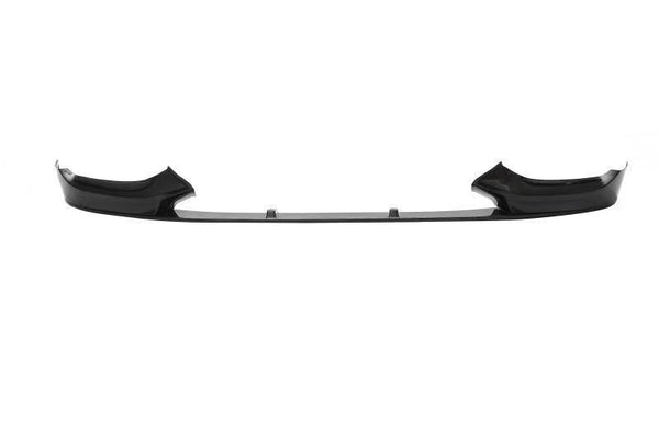 A black car front lip spoiler, elevated slightly, spans horizontally against a plain white background, suggesting aerodynamic enhancement for vehicle performance.