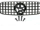A black vehicle grille with a lattice design includes four mounting brackets below. The grille features a central circular emblem space, set against a plain background.