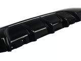 A black car bumper features multiple vertical fins, designed for aerodynamics, set against a plain white background.
