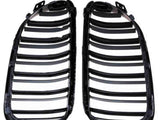 Two black plastic car grille inserts lie side by side, featuring multiple horizontal slats, against a plain white background.