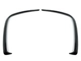 Two curved black plastic fender flares symmetrically facing each other, positioned on a plain white background.
