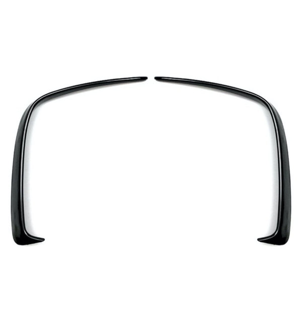Two curved black plastic fender flares symmetrically facing each other, positioned on a plain white background.