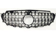 A car grille features vertical and horizontal chrome slats forming a grid pattern, with a circular emblem space in the center, set against a plain white background.