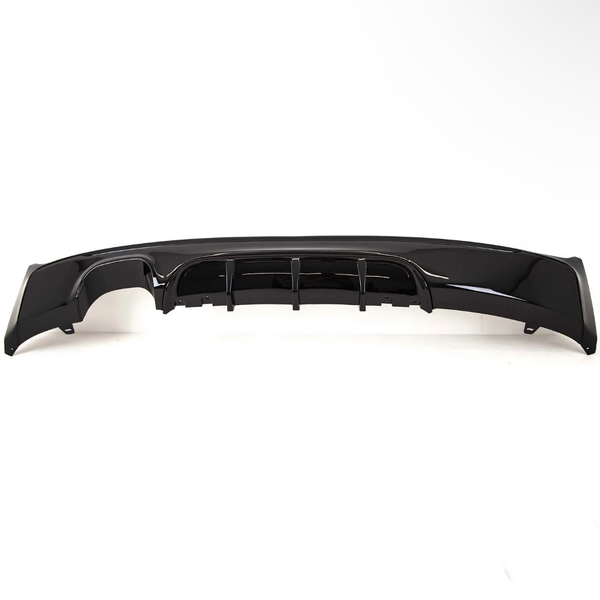A glossy black car bumper with aerodynamic fins is resting on a plain white background, showcasing its sleek design and contours.