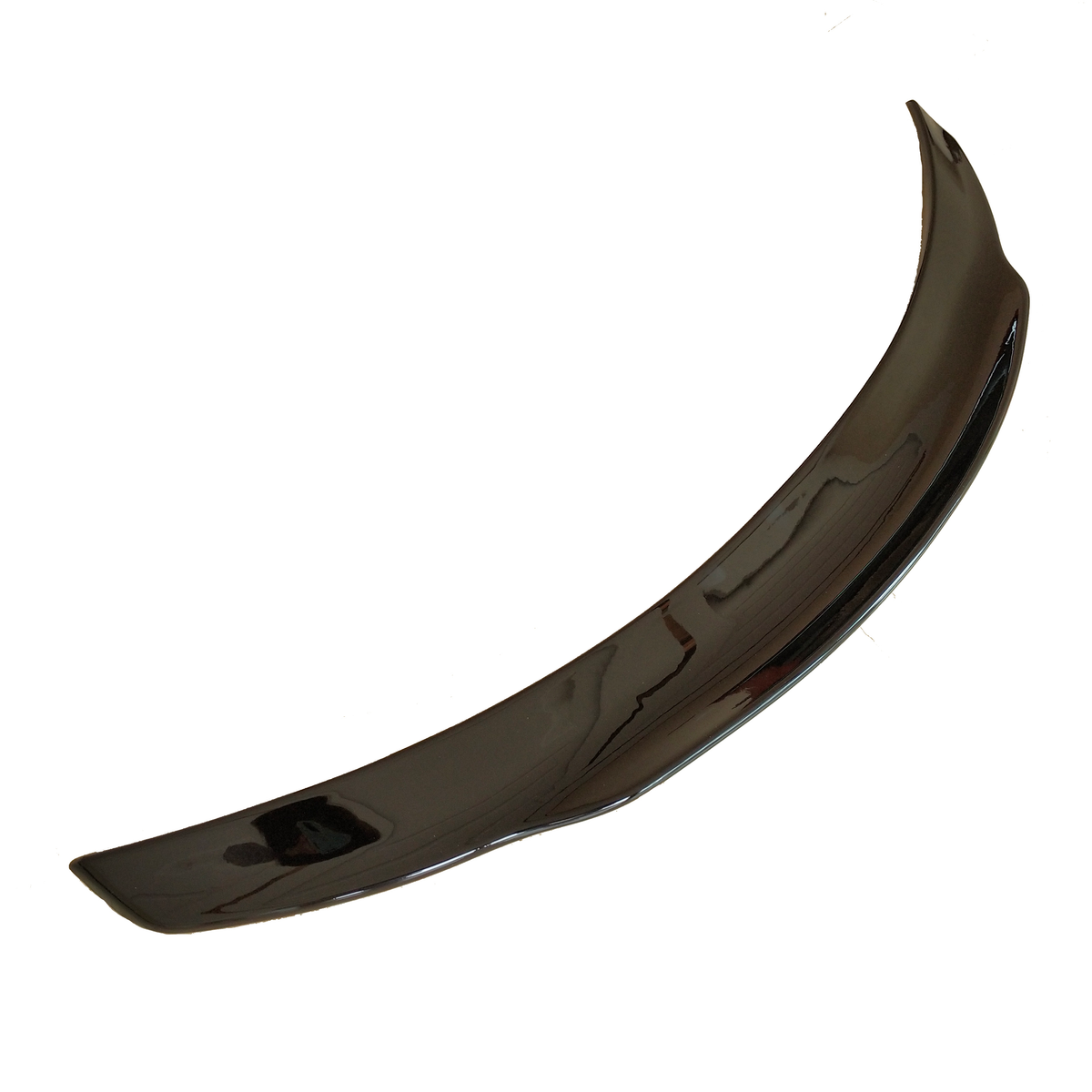 A curved, glossy, black car spoiler rests on a plain white background, appearing sleek and aerodynamic in design.