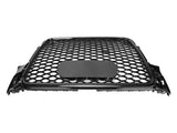 A black car grille features a honeycomb pattern with a central oval badge area, shown against a plain white background.