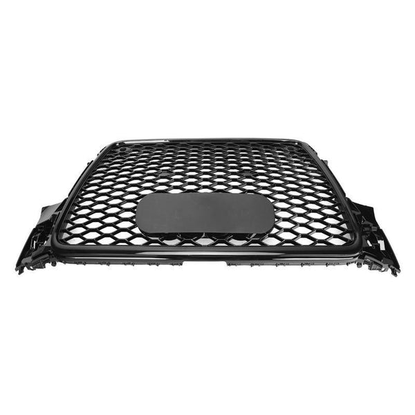 A black car grille features a honeycomb pattern with a central oval badge area, shown against a plain white background.