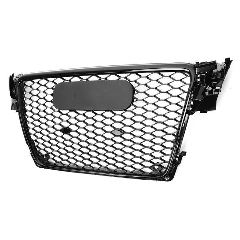 A black car grille features a honeycomb pattern with a blank, central oval plate, placed on a plain white background.