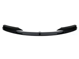 Black car front splitter with a glossy finish, featuring aerodynamic fins on both sides. It is isolated against a plain white background.