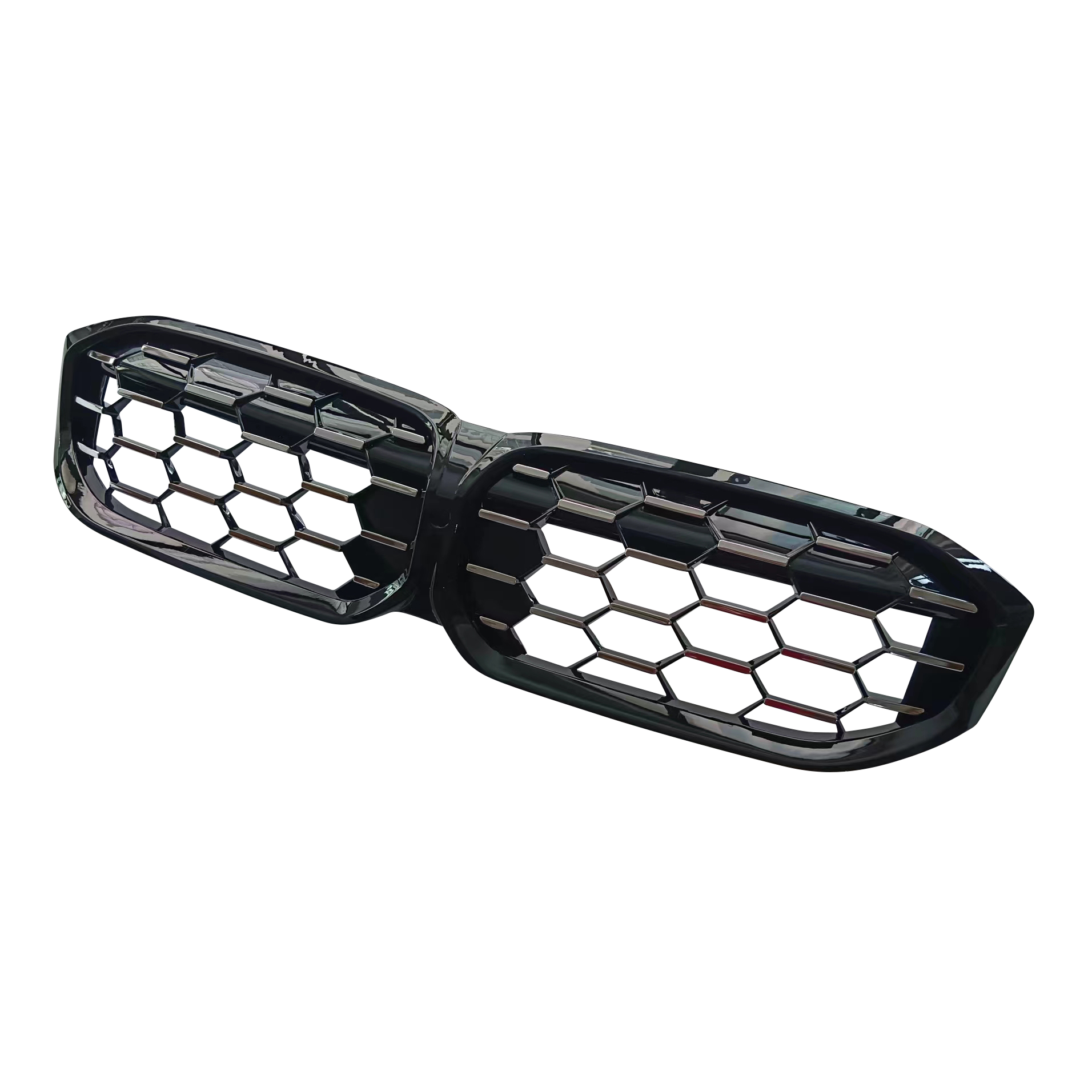 A dual-section car grille features a black hexagonal mesh design, positioned on a white background, suggesting automotive use.