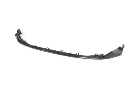 A glossy black car front splitter with mounting brackets displayed on a plain white background, showing its curved design and aerodynamic features.