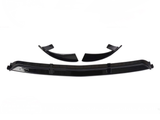 Black car spoiler parts are arranged on a white background, displaying four pieces including two curved segments and a long, straight piece, all designed for vehicle modification.