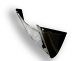 Shiny black and silver swooping blade-like structure, suspended at an angle, casting a soft shadow on a white background.