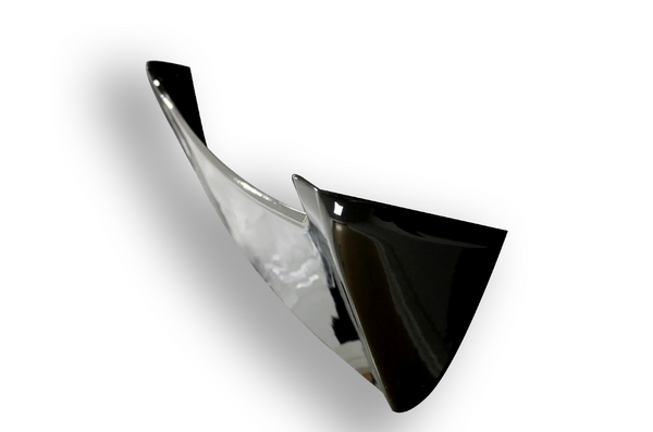 Shiny black and silver swooping blade-like structure, suspended at an angle, casting a soft shadow on a white background.