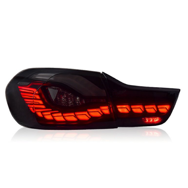 A sleek car taillight, illuminated with bright red LED bars, is set against a plain white background, highlighting its modern design and reflective surface.