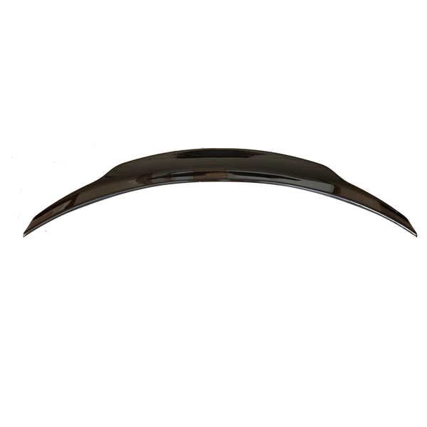 A sleek, curved car spoiler sits alone, centered against a plain white background.