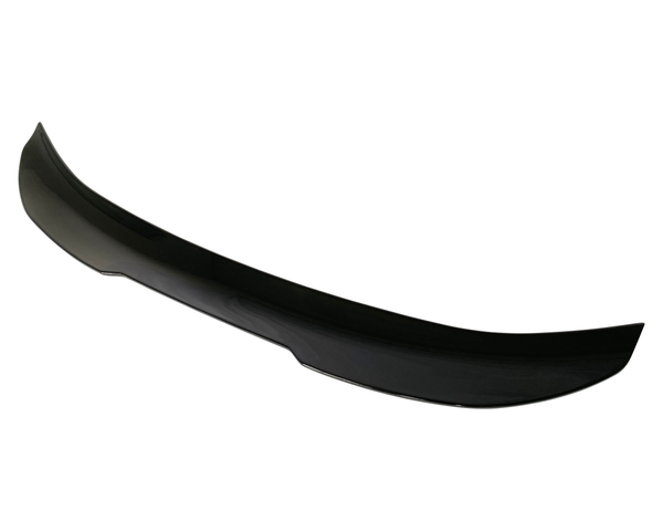 A glossy black car spoiler rests against a white background, its sleek, arched shape designed for aerodynamic enhancement.