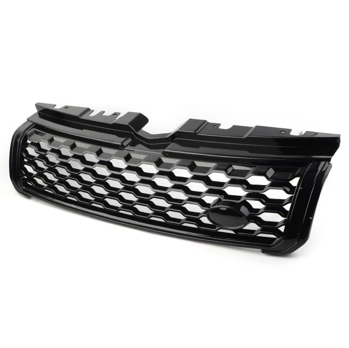 Black car grille with a honeycomb pattern, resting on a plain white surface, featuring a central oval space likely for logo placement, designed for front vehicle installation.