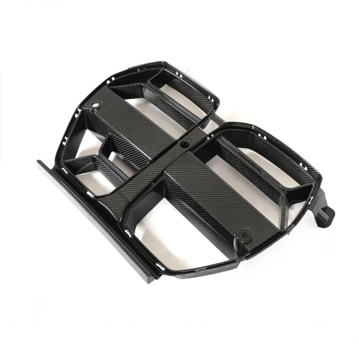 A carbon fiber car grille with a rectangular pattern lies on a white background, displaying its sleek, lightweight design.