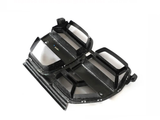 Carbon fiber car grille, angled forward, showing a sleek, black design with angular slats. Positioned on a white background, it appears ready for installation.