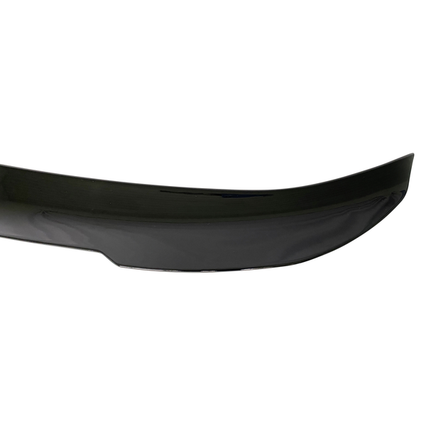 A black car spoiler with a smooth, glossy finish is shown, featuring a slightly curved design, set against a plain white background.