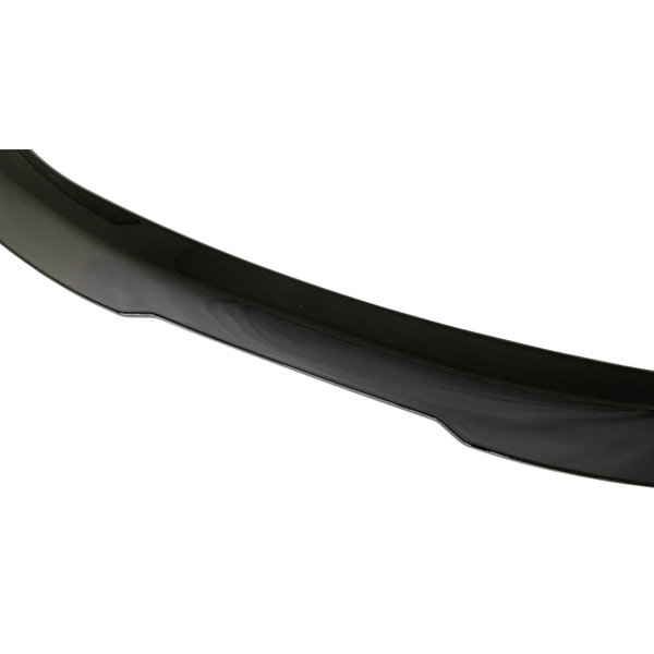 A glossy, black car bumper spoiler displayed against a white background, emphasizing its curved shape and sleek finish.