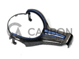 A carbon fiber car steering wheel trim with a blue accent rests on a plain surface. Text reads 