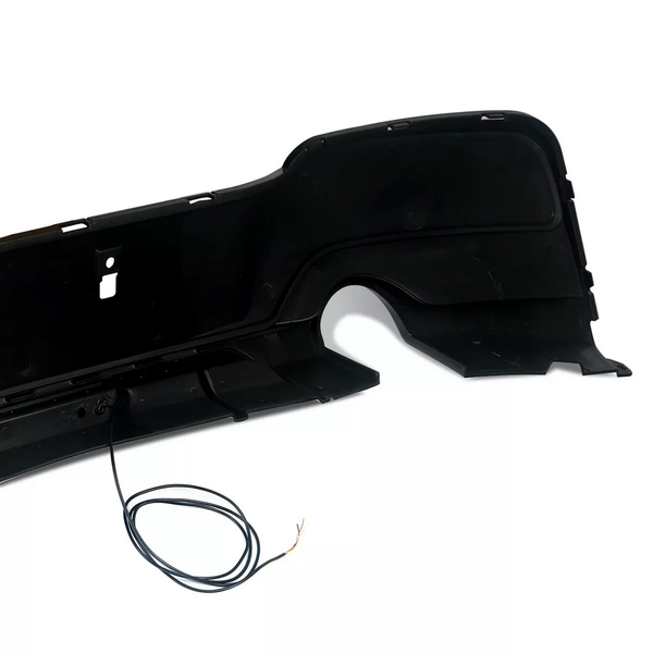 A black car bumper with sectioned panels and an extended wire sits against a plain white background.