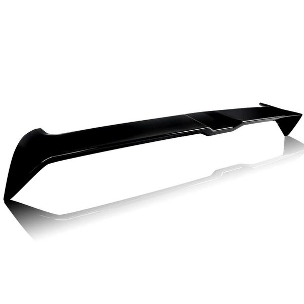 A sleek black car spoiler rests on a reflective white surface, showcasing its aerodynamic design and angled edges.