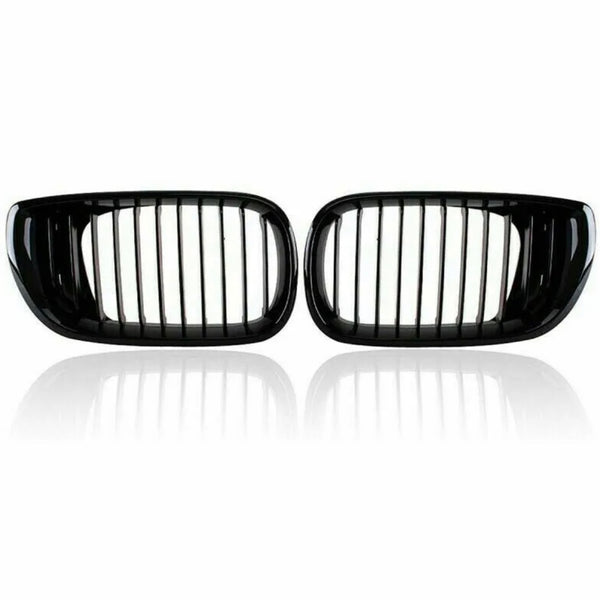 Two black car kidney grilles with vertical slats are shown against a plain white background, reflecting slightly underneath, suggesting a glossy surface.