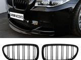 A black car front features a sleek kidney grille, with the text 
