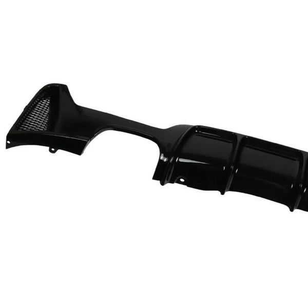 Black car bumper diffuser, featuring a glossy finish and integrated mesh vent, displayed against a white background. The design includes curved aerodynamic grooves for enhanced vehicle performance.