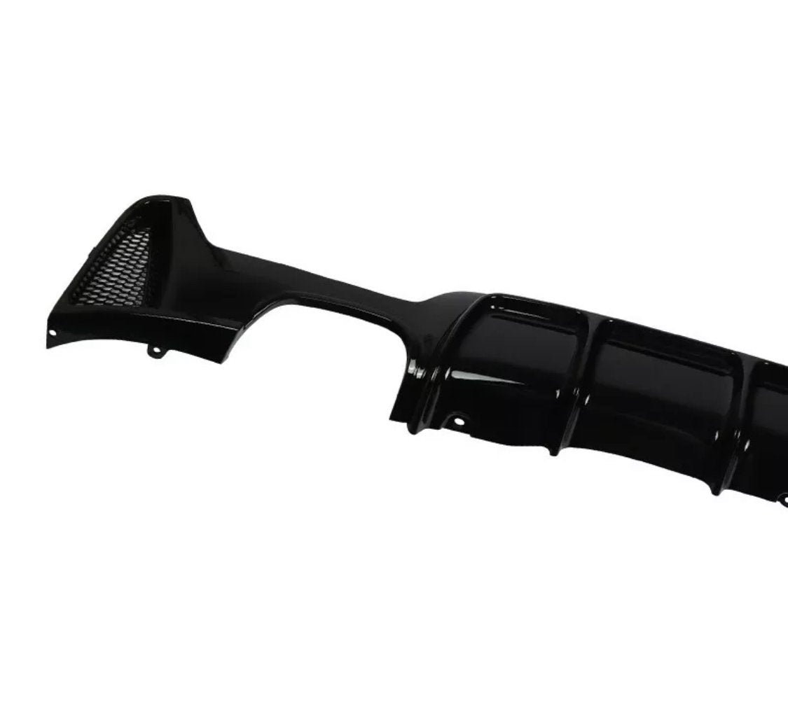 Black car bumper diffuser, featuring a glossy finish and integrated mesh vent, displayed against a white background. The design includes curved aerodynamic grooves for enhanced vehicle performance.