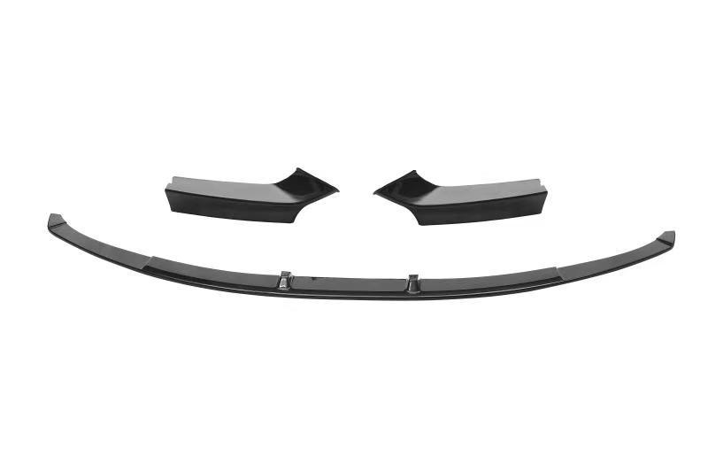 Three black car bumper pieces are laid out separately, appearing ready for assembly. They are displayed on a plain white background, showcasing their sleek, curved design.