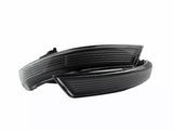 A pair of sleek, black car side mirror indicators with aerodynamic lines, positioned against a plain white background.