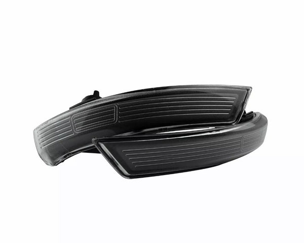 A pair of sleek, black car side mirror indicators with aerodynamic lines, positioned against a plain white background.