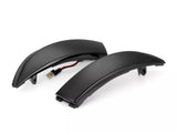 Two black curved LED indicator lights rest on a white background, each featuring a connected wire and plug, designed for automotive or motorcycle use as signal lights.