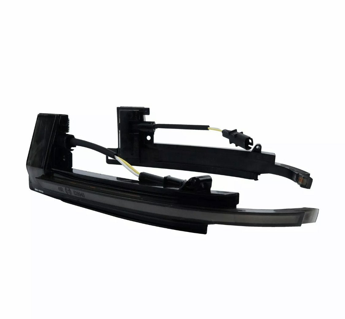 Black car side mirror indicators with wiring cables are positioned against a plain white background. The parts are disassembled, showing connectors and a sleek curved design.