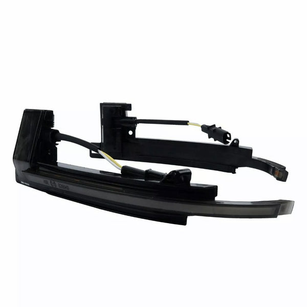 Black car side mirror indicators with wiring cables are positioned against a plain white background. The parts are disassembled, showing connectors and a sleek curved design.