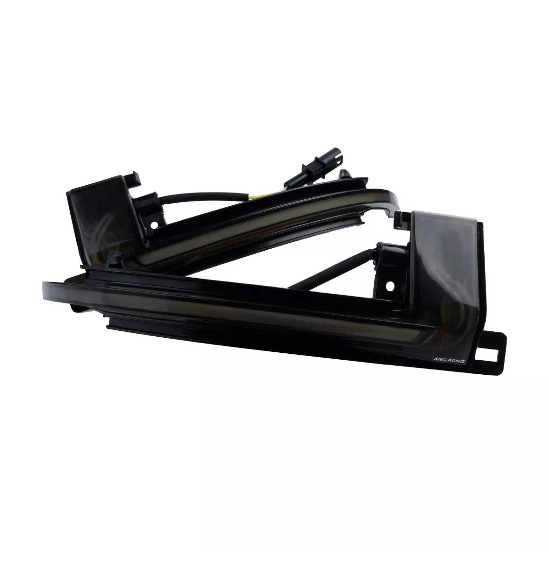 A sleek black automotive light fixture with wiring, labeled "AMG RGNG," against a white background, showcasing its angular design and curved edges.