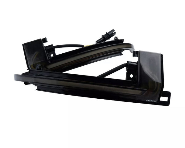 A pair of black plastic automotive light housings with wiring connectors, labeled "AMG SONG," are shown against a plain white background.