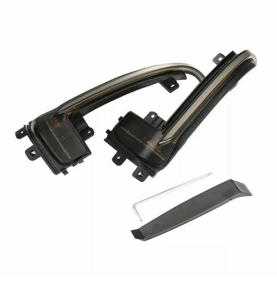 Two black, curved car mirror turn signal lights with mounting brackets, accompanied by a small, thin metal tool and a black plastic trim piece, placed on a plain white background.