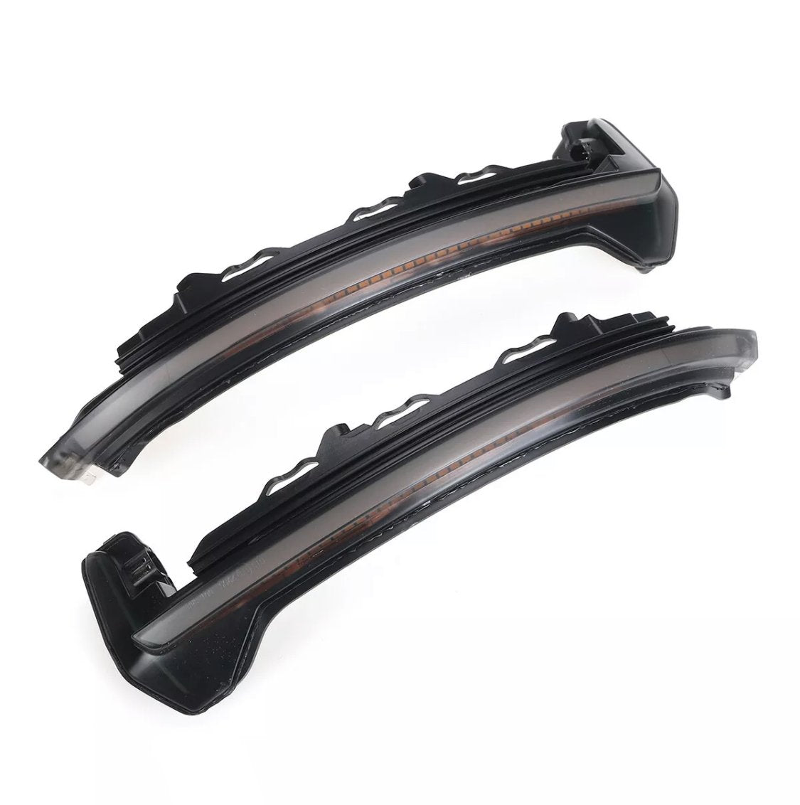 Curved LED light strips, unlit and black, rest against a white background, displaying mounting brackets on one side for automotive use.