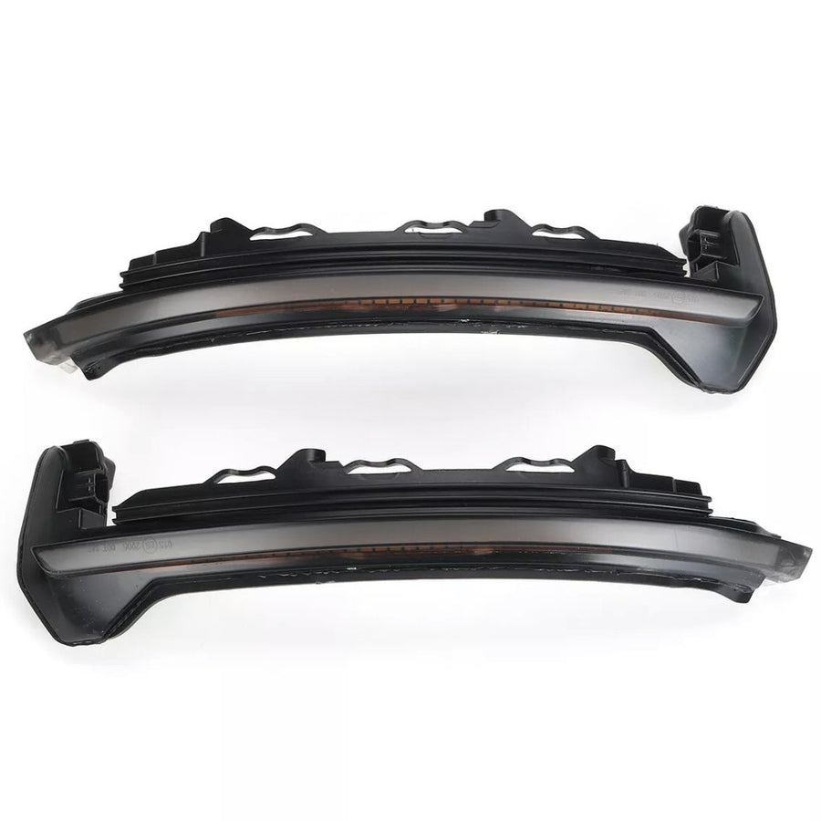 Two dark, sleek car LED rearview mirror indicators are parallel, displaying a modern design. The context is a plain white background, highlighting the components' structure.