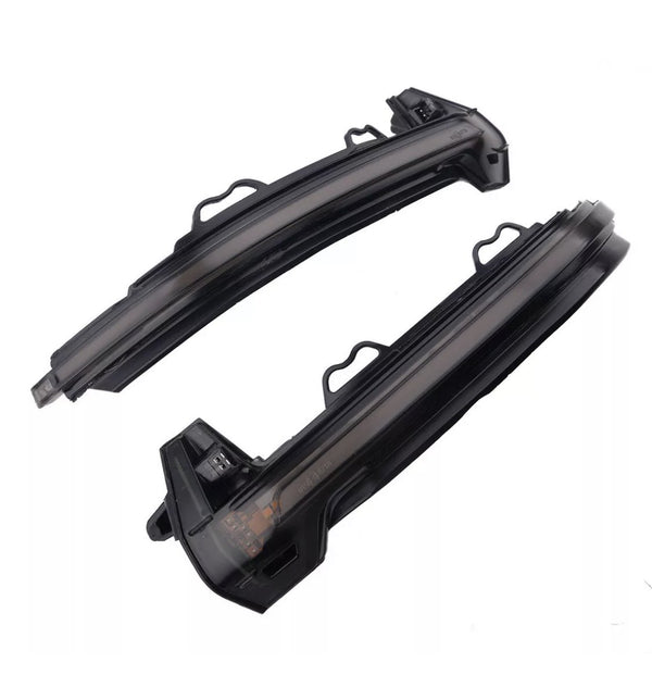 Two curved black LED car indicator lights rest side by side against a white background, featuring integrated connectors and mounting brackets for vehicle installation.