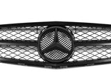 A car grille with a geometric mesh pattern surrounds a central emblem, featuring a three-pointed star, against a plain white background.